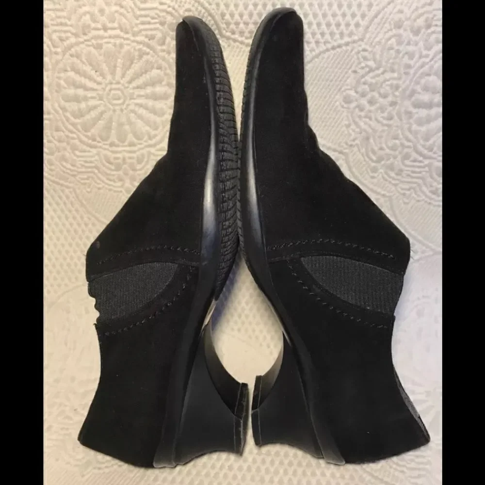 Stuart Weitzman black suede slip ons
